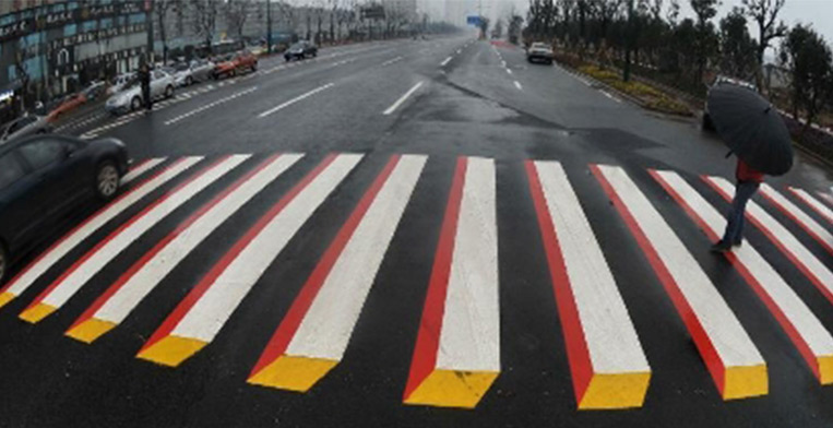 Zebra signs painted to look like solid blocks makes approaching drivers slow down.