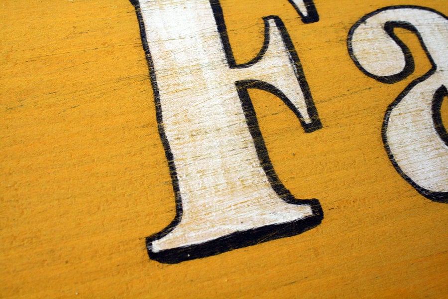 Distressed lettering giving an impression of age can be achieved manually